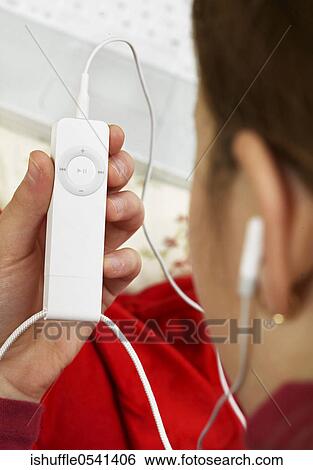 Stock Photograph - Still Life, Over the Shoulder, Conceptual, Headphones, iPod, Hand. Fotosearch