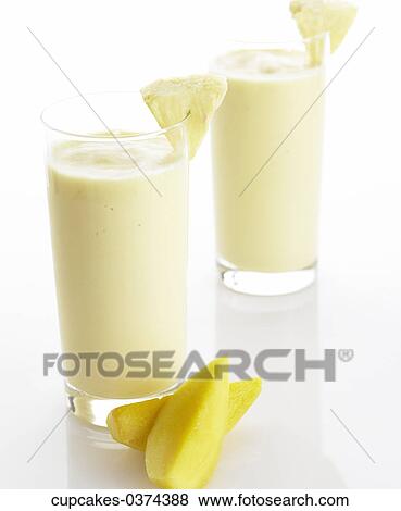Stock Photo - Two, Mango, Pineapple, White, Smoothie, Glass. Fotosearch