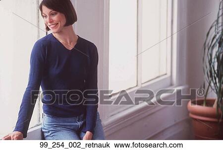 Woman, Sitting, Window, Sit, Window Sill, Plant, Bright View Large Photo Image Stock Image - Woman, Sitting, Window, Sit, Window Sill, Plant, Bright. Fotosearch