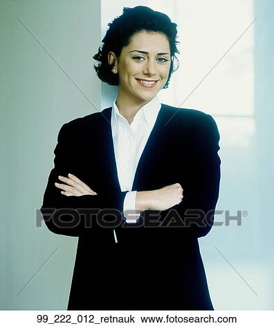 Stock Image - Woman, Suit, Business, Indoors, Confident, Successful, Vertial. Fotosearch