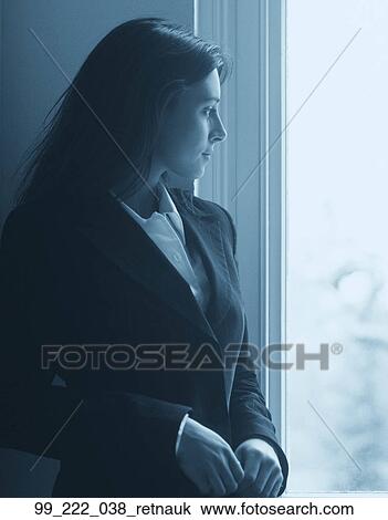 Stock Image - Woman, Suit, Business, Indoors, Stress, Pensive. Fotosearch