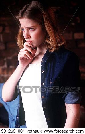 Stock Image - Woman, Thinking, Think, Hand On Chin, Pensive, Staring, Stare. Fotosearch