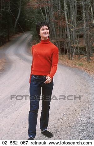 Woman, Walking, Denim, Sweater, Turtleneck, Outdoors View Large Photo Image Stock Image - Woman, Walking, Denim, Sweater, Turtleneck, Outdoors. Fotosearch