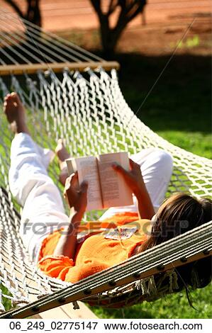 Book, Dark, Hammock, Lying, Nature, Outside, Person View Large Photo Image Stock Photo - Book, Dark, Hammock, Lying, Nature, Outside, Person. Fotosearch