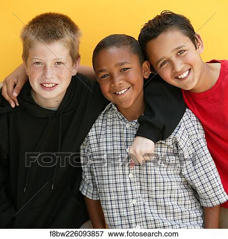 Stock Photo - Boys, Friends, Happy, Smiling, Eye, Contact. Fotosearch