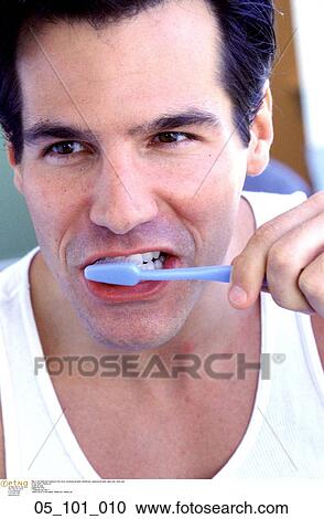 Stock Image - brushing, his, teeth, toothbrush, cleaning, his, teeth. Fotosearch