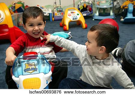 Stock Photograph - Family, Members, Boys, Toys, Playing, Affectionate, Hispanic. Fotosearch