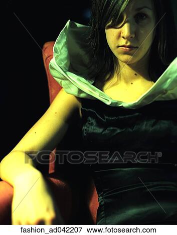 Stock Photo - Fashion, Woman, Staring, Sitting. Fotosearch