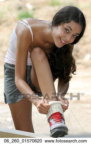 Outside, Summer, Socks, Teen, Teenage, Teenager, Adjusting View Large Photo Image Stock Image - Outside, Summer, Socks, Teen, Teenage, Teenager, Adjusting. Fotosearch