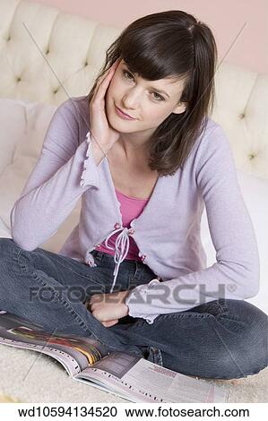 pink, camisole, blue, jeans, Sitting View Large Photo Image Stock Image - pink, camisole, blue, jeans, Sitting. Fotosearch