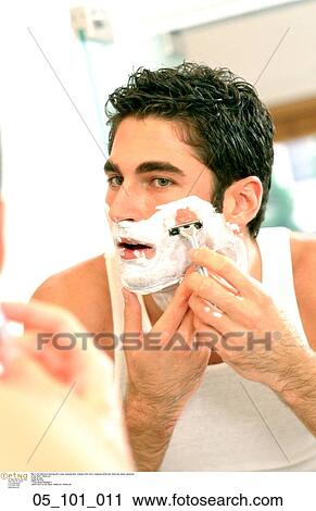 Stock Image - shaving, foam, looking, mirror, wearing. Fotosearch