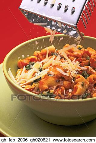 Stock Image - shredded cheese grater macaroni. Fotosearch