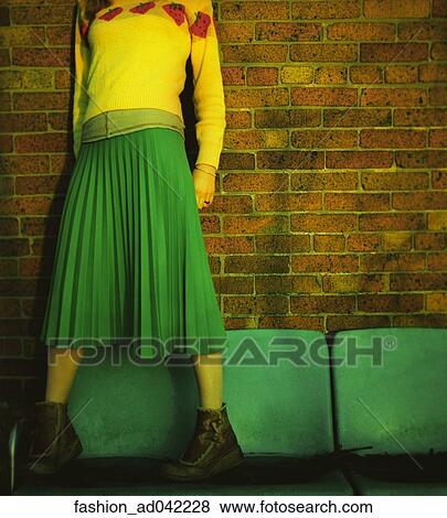 Stock Photo - Sweater, Skirt, Bench, Color, Green, Yellow, Woman. Fotosearch