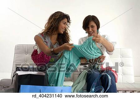 Stock Image - they, showed, off, thier, new, clothing, acquiring. Fotosearch