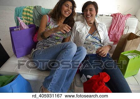 Stock Photo - they, showed, off, thier, new, clothing, acquiring. Fotosearch