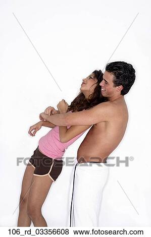 Stock Photo - Topless, Together, Shorts, Playful, Love, Laughing, Intimate. Fotosearch