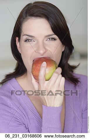 Stock Photograph - woman, bite, apple. Fotosearch