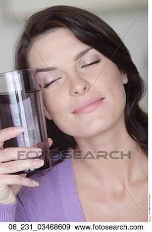 Stock Photo - woman, glass, water. Fotosearch
