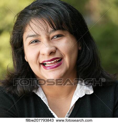 Stock Image - Woman, Headshot, Eye, Contact, Color, Latin, Smiling. Fotosearch