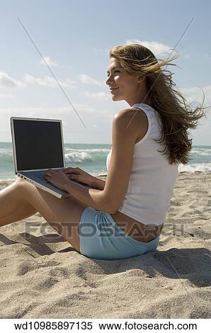 working, holiday, working, abroad, windblown, hair View Large Photo Image Stock Photography - working, holiday, working, abroad, windblown, hair. Fotosearch