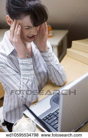 Stock Photo - working, image, 35, twenties, tired. Fotosearch