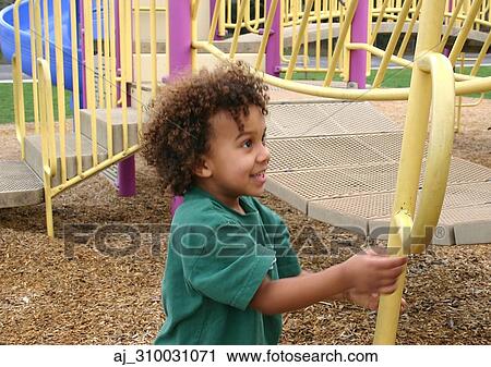 Stock Image - youth, playing, playground, Kid, horizontal, happy, curly. Fotosearch