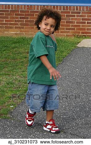 Stock Image - youth, playing, playground, outside, Kid, happy, denim. Fotosearch