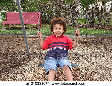 Picture - youth, swinging, playing, playground, Kid, horizontal, happy. Fotosearch