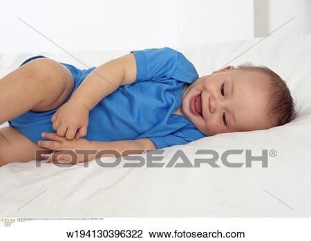 Stock Image - babies, solo, families, 9 months, under 12 months, smiling. Fotosearch