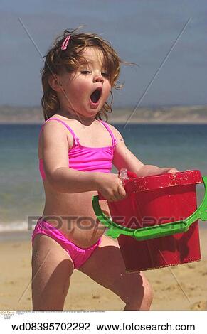 Stock Image - beach, families, under 2 years, toddler, surprised expression. Fotosearch