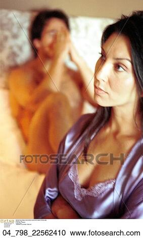 Stock Image - Bedroom, Unhappy, Couple, Arguement, Fighting, Cuacasian, Brunette. Fotosearch