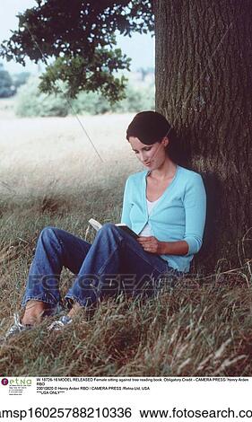 Stock Photograph - brunette hair, countryside, european descent, jeans, lifestyle, Outside. Fotosearch