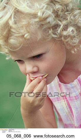 Child, Outside, Girl, Eating View Large Photo Image Stock Photograph - Child, Outside, Girl, Eating. Fotosearch