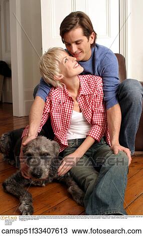 Stock Image - Couple, At Home, Woman, Affectionate, Happy, Inside. Fotosearch