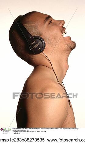 Stock Photography - DJ, head and shoulders, gold tooth, facial hair, afro caribbean descent. Fotosearch