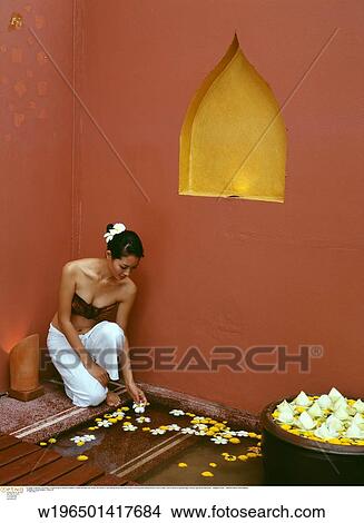 Picture - glamorous, exotic, ethnic, under 35, Plumeria (Frangipani) flowers. Fotosearch