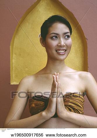 Stock Photograph - glamorous, exotic, ethnic, under 35, Thai greeting. Fotosearch