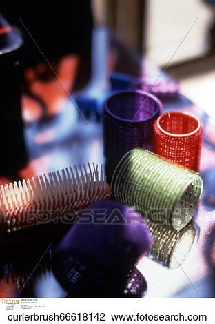 Stock Image - Hairbrush / brush and curler / curlers. Fotosearch