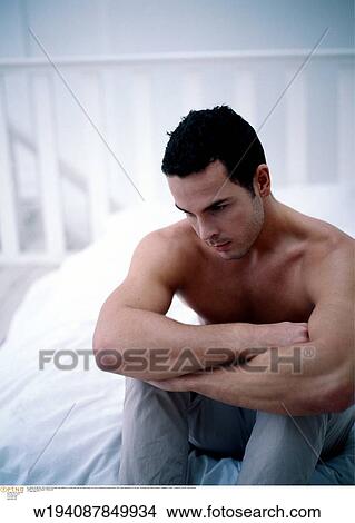 in the bedroom, vertical image, unhappy, under 35, twenties View Large Photo Image Picture - in the bedroom, vertical image, unhappy, under 35, twenties. Fotosearch