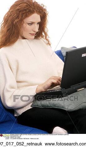 Stock Image - Indoor, Inside, Caucasian, Red Hair, Sitting, Technology. Fotosearch