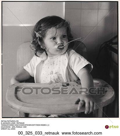Stock Image - kitchen, inside, eating, baby, child, toddler, food. Fotosearch