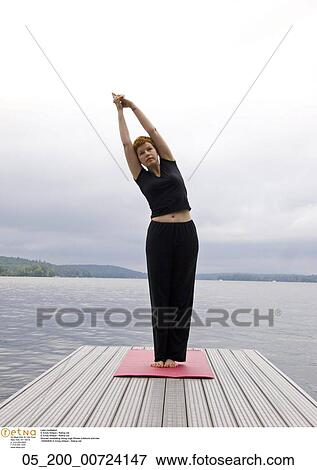 Stock Photo - lake meditation, Fitness, Meditiation, Woman, Yoga, Exercise, Caucasian. Fotosearch