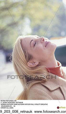 Stock Image - Outside, Outdoors, Blond, Happy, Caucasian, Smiling. Fotosearch