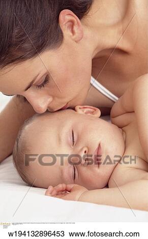 Stock Image - parent and child, families, 9 months, vertical image, under 35 years, under 12 months. Fotosearch