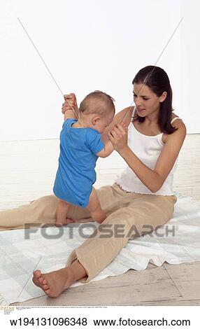 parent and child, families, 9 months, vertical image, under 35 years, under 12 months View Large Photo Image Stock Photo - parent and child, families, 9 months, vertical image, under 35 years, under 12 months. Fotosearch