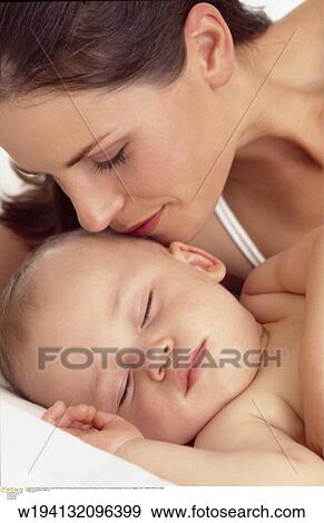 Stock Photo - parent and child, families, 9 months, vertical image, under 35 years, under 12 months. Fotosearch