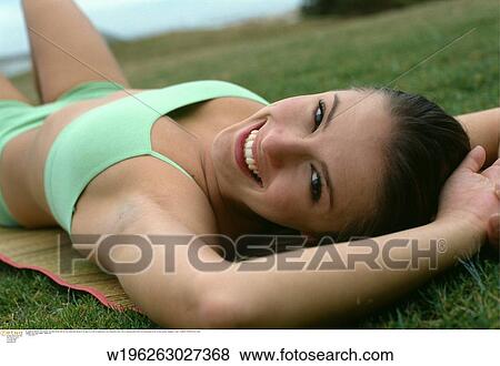 Stock Photo - smiling, under 35, solo, thirties, twenties, abroad. Fotosearch