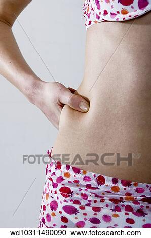 Stock Image - solo, weight loss, vertical image, underwear with strawberry pattern, under 35. Fotosearch