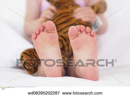 Stock Photo - summer, families, toddler, toes, under 2 years, studio, anonymous. Fotosearch