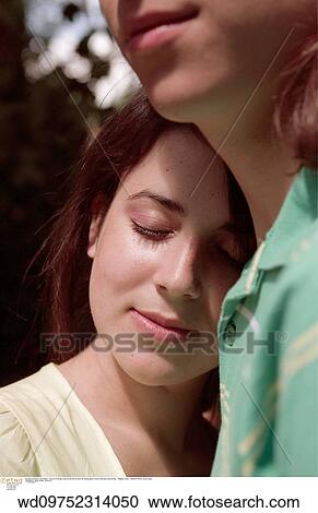Stock Image - summer, young love, teenage, teenage couple, teenager, anonymous male. Fotosearch